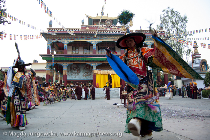 Lama dances in front of Karma Tharjay Chokhorling