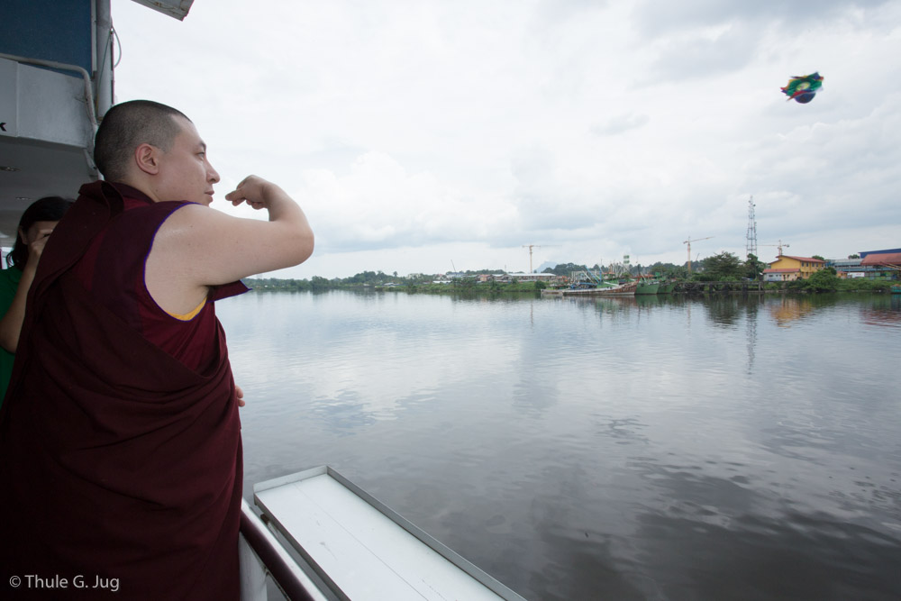 His Holiness Gyalwa Karmapa, Rinpoches and monks perform a Naga Vase Puja on board of a Sarawak River Cruise boat