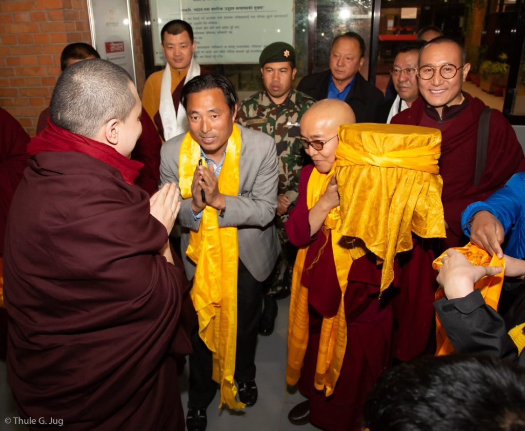 Karmapa is welcomed by Mr Rabindra Prasad Adhikari, Minister of Culture, Tourism and Civil Aviation in Nepal, Venerable Sang Sang Rinpoche, Venerable Lodro Rinpoche, and other lamas and local devotees.
